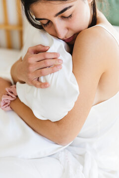 Girl hugging the pillow
