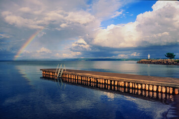 Fototapeta na wymiar rainbow at lake vaettern near habo in sweden
