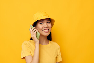 woman with Asian appearance talking on the phone posing fashion Lifestyle unaltered