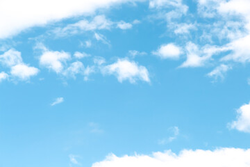 Clouds soft patterns on bright blue sky background with space