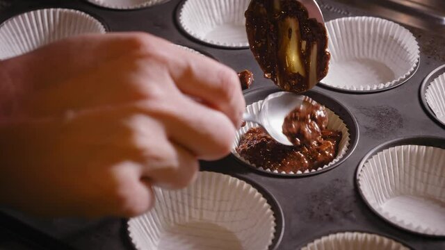 Pouring Mixture Of Chocolate Oat Cake Into Baking Mold With Baking Paper. time lapse