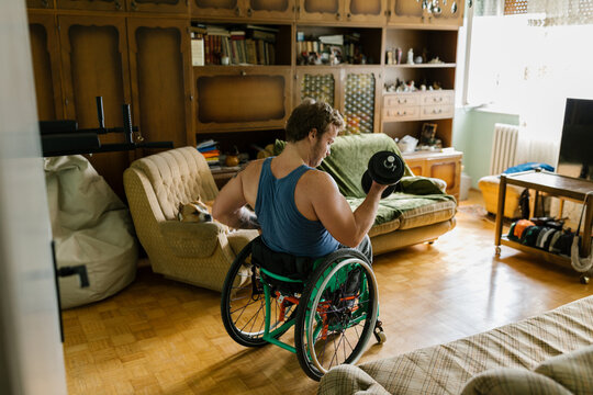 Disabled Man Exercising At Home