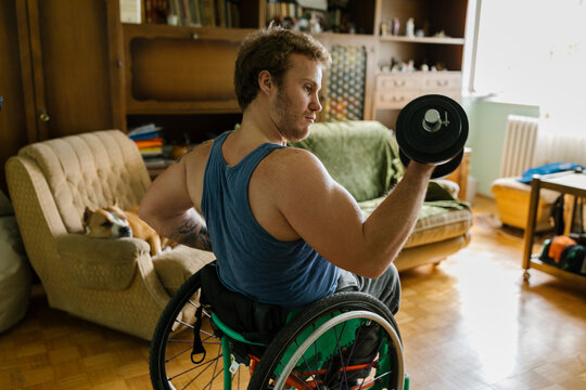 Disabled Man Exercising At Home