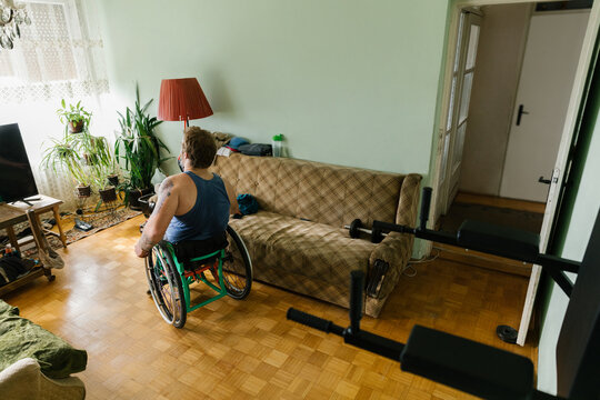Physically Disabled Man In Living Room