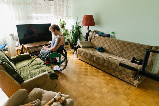 Physically Disabled Man Using His Mobile Phone