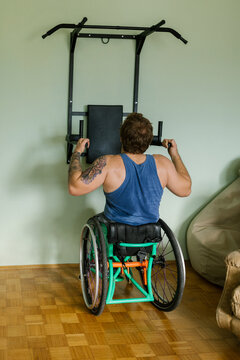 Man In A Wheelchair Preparing For A Home Training