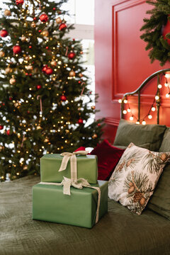Gifts on bed near Xmas tree