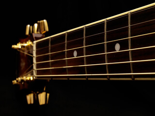 Classical guitar on black background