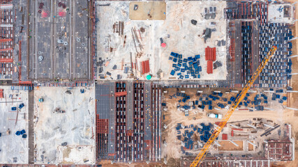Aerial view construction site with tower crane and building construction site, Construction sites and many cranes and heavy construction working in the industry new building business.