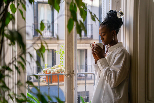 Cute Black Girl Warming Up Having A Hot Drink At Home