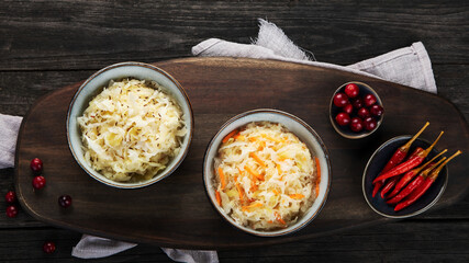 Sauerkraut on wooden background.