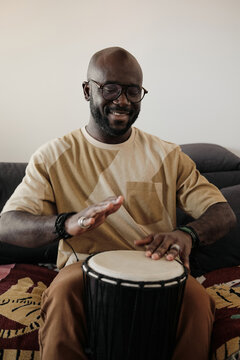 Black Man Playing Djembe