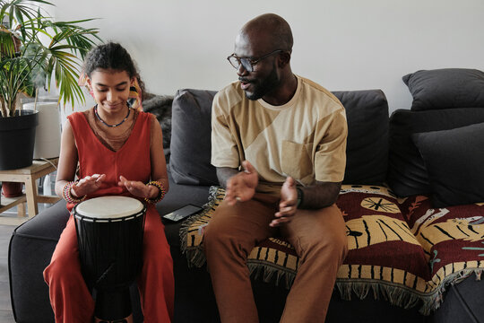 Girl Playing Djembe
