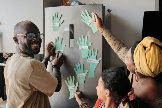 Sticking Paper Hands On Fridge
