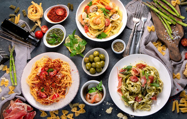 Pasta assortment on dark background.
