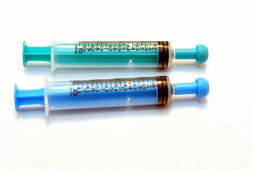 Selective focus of 10 millimeters oral syringes for infants and children to administer liquids,...