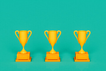 three Yellow trophy on green background