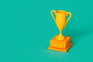 Yellow trophy on green background with copy space