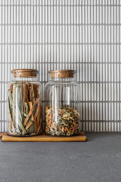 Glass pasta canisters in a kitchen
