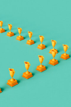 rows of Yellow trophies on green background