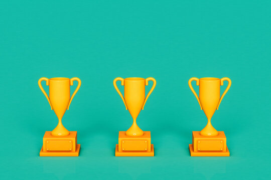 three Yellow trophy on green background