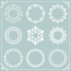 Vintage set of round white elements. Different elements for design frames, cards, menus, backgrounds and monograms. Classic patterns. Set of vintage patterns
