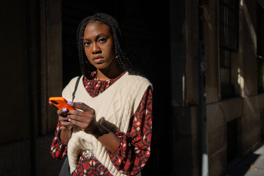 Beautiful Black Woman With Phone On The Street.