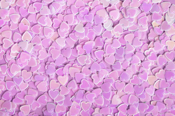 Sparkle confetti hearts purple texture. Valentines day background. Top view, flat lay