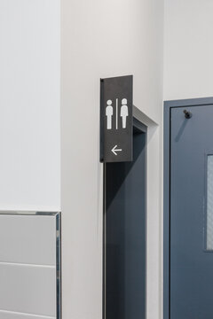 Close-up of bathroom guide sign.