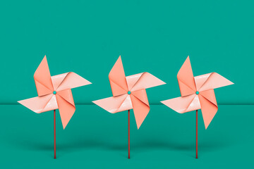 frontal view of pink Pinwheels. wind energy concept.