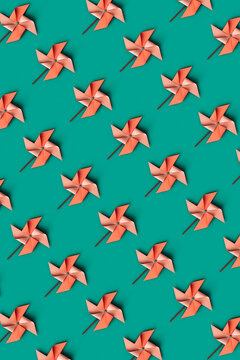 top-down view of pink Pinwheels on a green background.