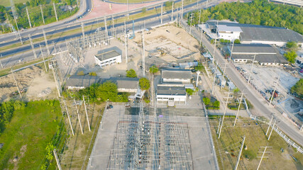 Aerial view of electricity generating, voltage poles. Power lines on utility tower and cable wires in energy electric technology, network, and industry. Generator pylon. Transmission and substation.
