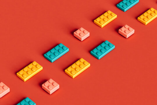 rows of pink, blue and yellow building blocks
