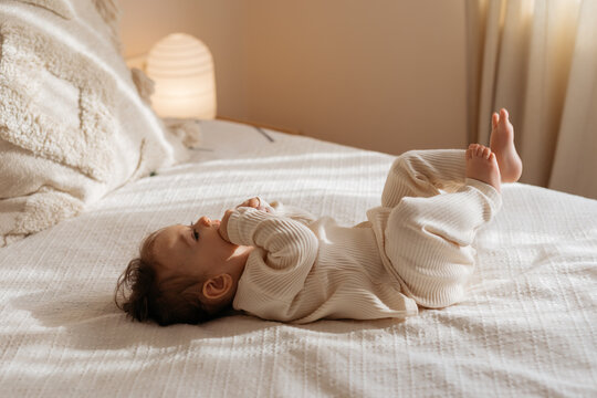Baby Girl On Bed