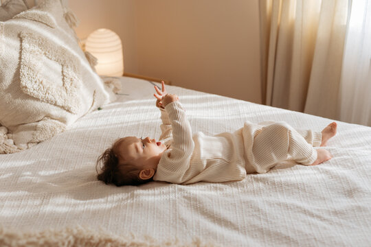 Baby Girl On Bed