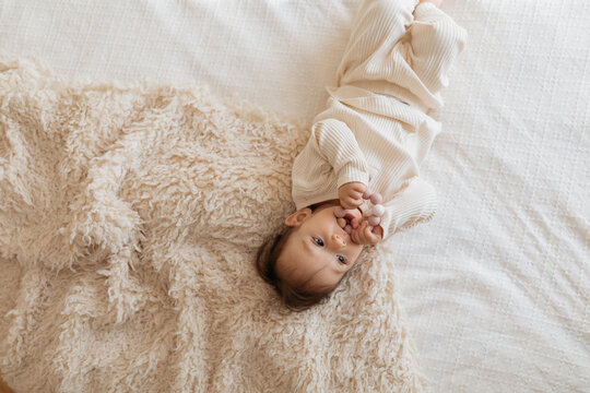 Baby Girl On Bed