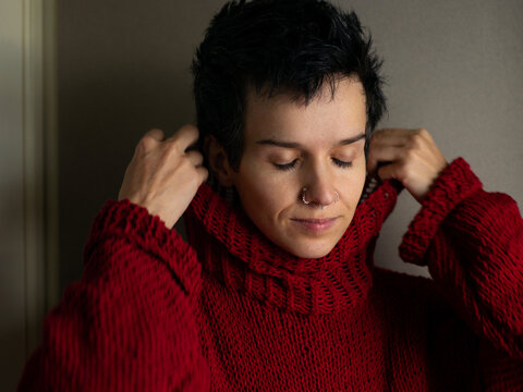 Portrait of a young woman in a red sweater