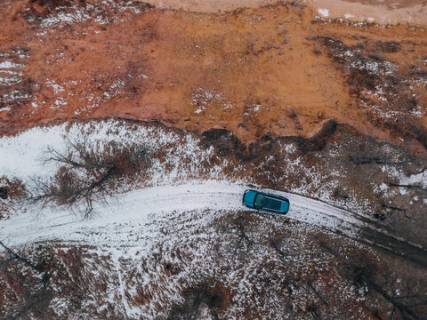 drone top-down view of a car in the wild