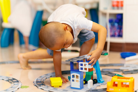 kid playing building block game