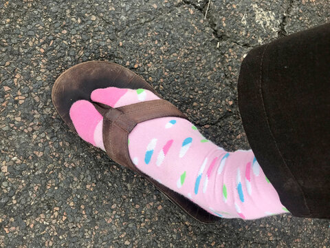 Pink socks in slippers