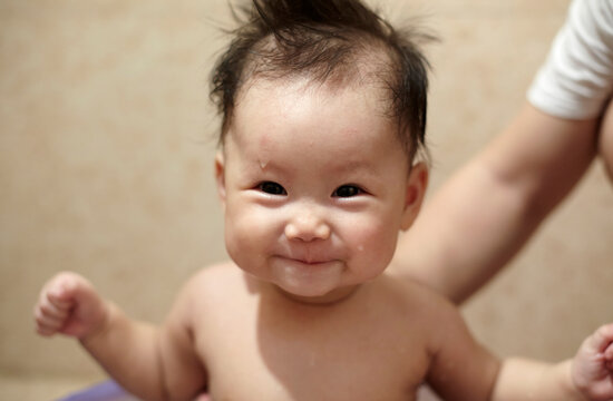 Closeup of Asian baby in the bathroom