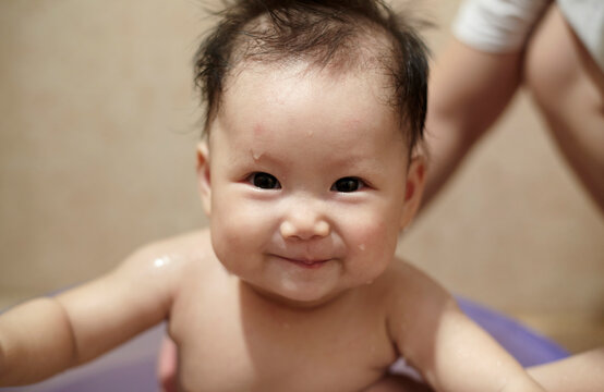 Closeup of Asian baby in the bathroom