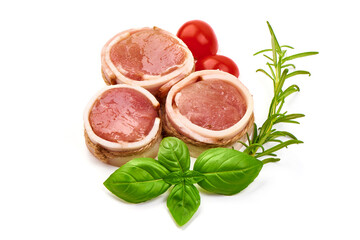 Pork medallions wrapped in bacon. Fresh raw pork tenderloin, isolated on white background.