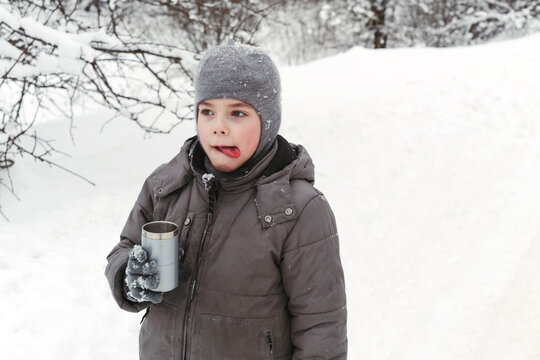 Child walks outside in winter.