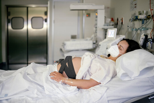Pregnant woman being monitored before giving birth.
