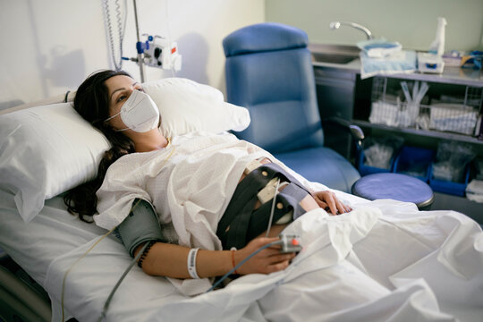 Pregnant woman being monitored before giving birth.