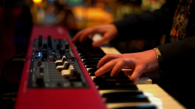 young musician playing the electronic keyboard