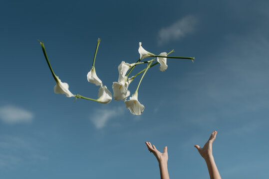 female throwing  flowers