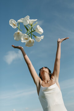 female throwing  flowers