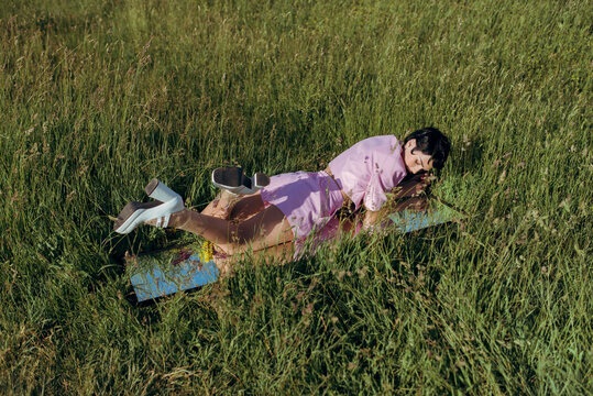 a woman lying on the grass
